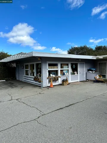 a view of a car park in front of the house