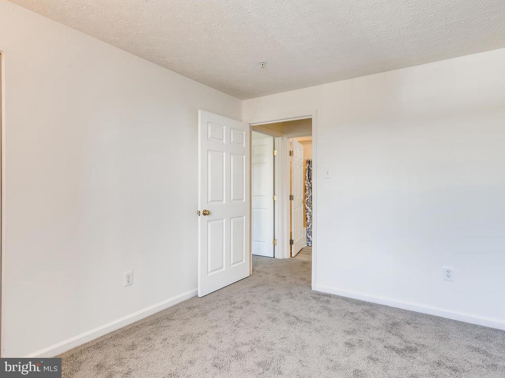 8241 Poplar Mill Road, Unit 8241 Baltimore, MD 21236 - Photo 20 of 26 BEDROOM 2 w/BRAND NEW CARPET!