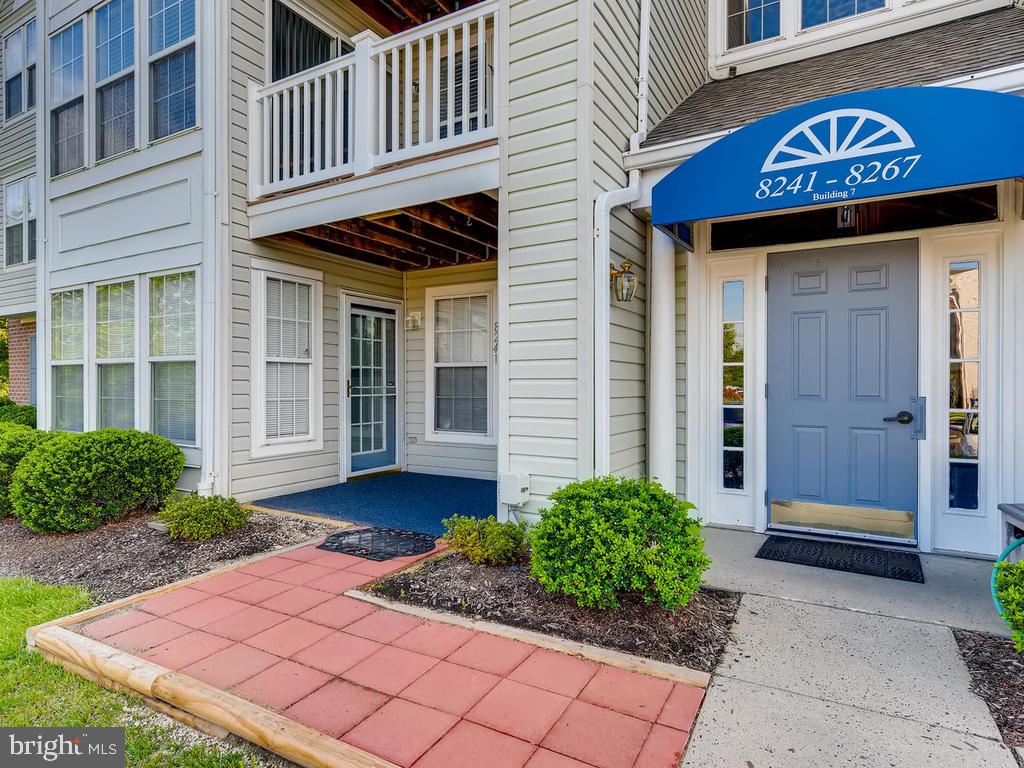 8241 Poplar Mill Road, Unit 8241 Baltimore, MD 21236 - Photo 3 of 26 PATIO ENTRY w/NEW PAVERS & OUTDOOR CARPET !