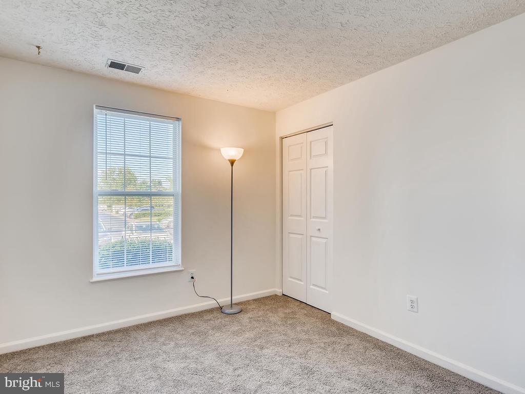 8241 Poplar Mill Road, Unit 8241 Baltimore, MD 21236 - Photo 21 of 26 BEDROOM 2 w/BRAND NEW CARPET!