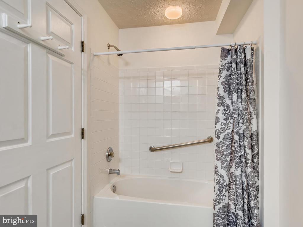 8241 Poplar Mill Road, Unit 8241 Baltimore, MD 21236 - Photo 23 of 26 BATHRM @ w/TUB SHOWER & NEW WOOD-STYLE FLOORING!