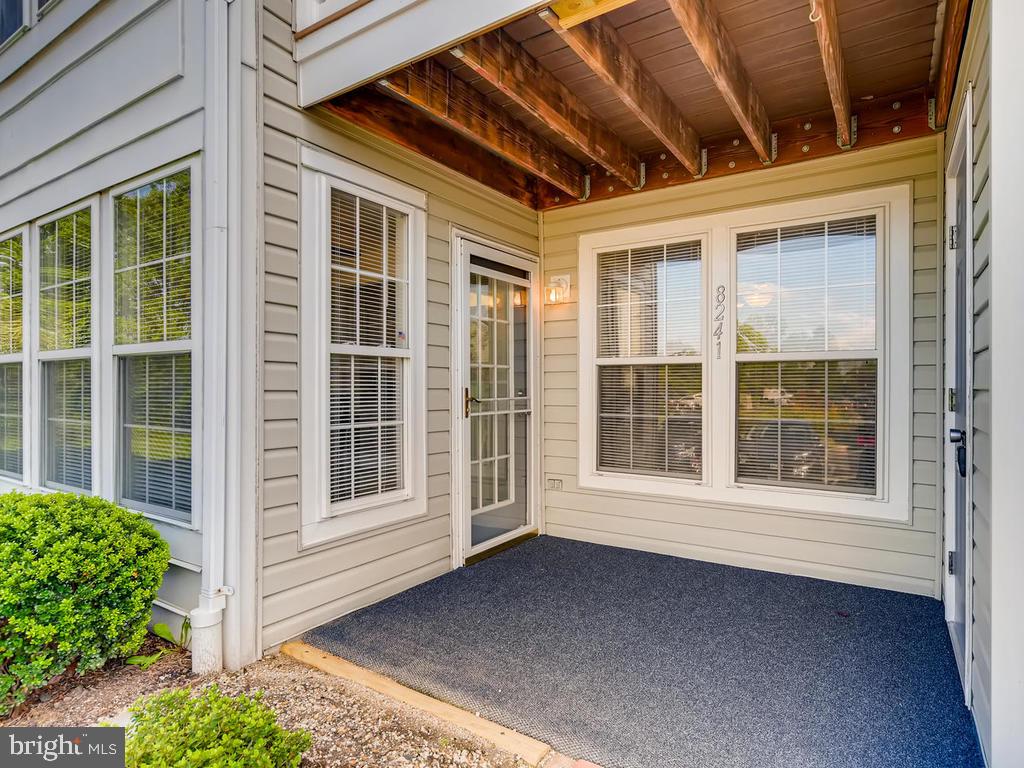 8241 Poplar Mill Road, Unit 8241 Baltimore, MD 21236 - Photo 4 of 26 COZY COVERED PATIO w/FRENCH DR ENTRY & STORAGE RM!
