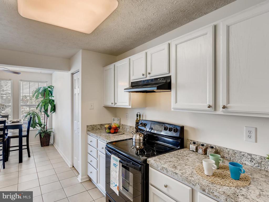 8241 Poplar Mill Road, Unit 8241 Baltimore, MD 21236 - Photo 8 of 26 BRIGHT AIRY KITCHEN w/PLENTY OF COUNTERSPACE!