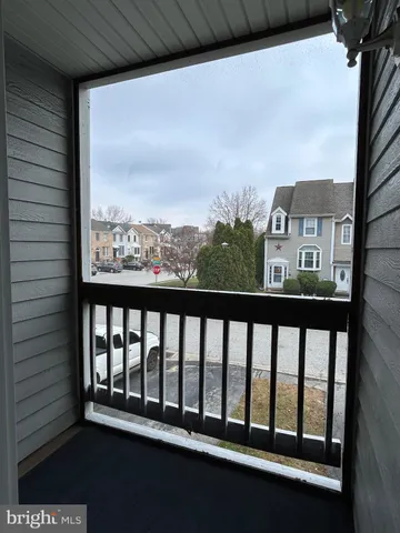 a view of a balcony with furniture