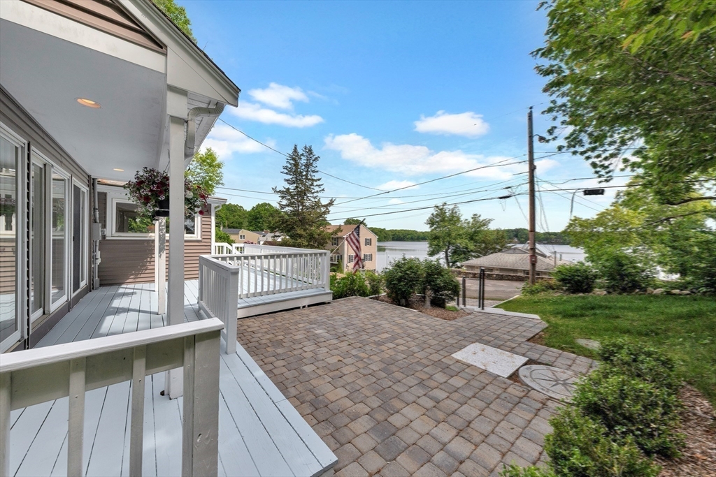 118 Woolford Road Wrentham, MA 02093 - Photo 35 of 41 a view of a patio with a table and chairs