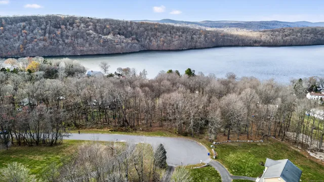 a view of a swimming pool with a yard