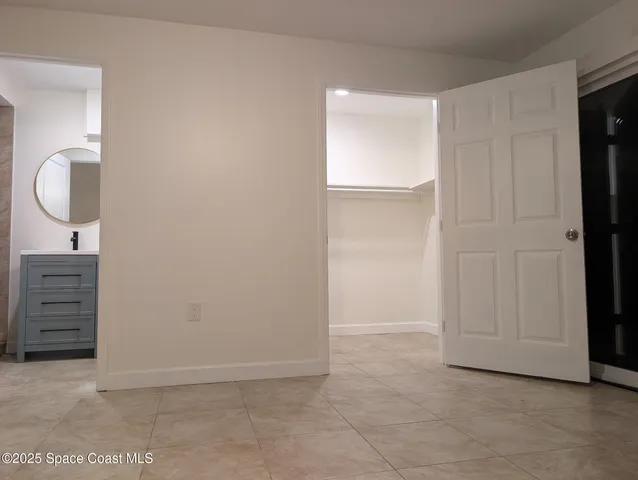 an empty room with cabinet door