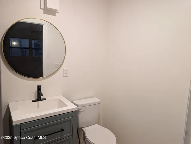 a bathroom with a toilet and a sink