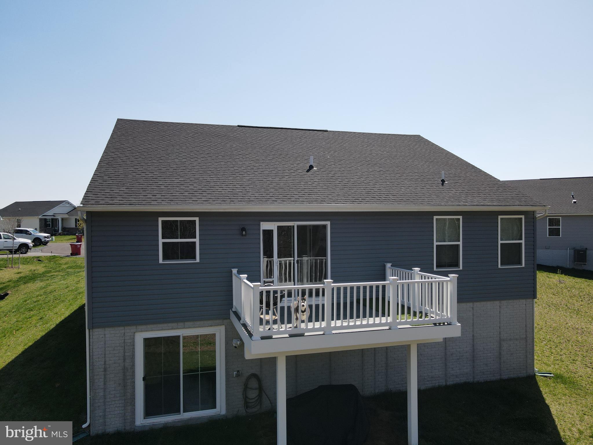 111 Tilapia Road Inwood, WV 25428 - Photo 5 of 29 a balcony of a house with wooden floor outdoor seating and yard