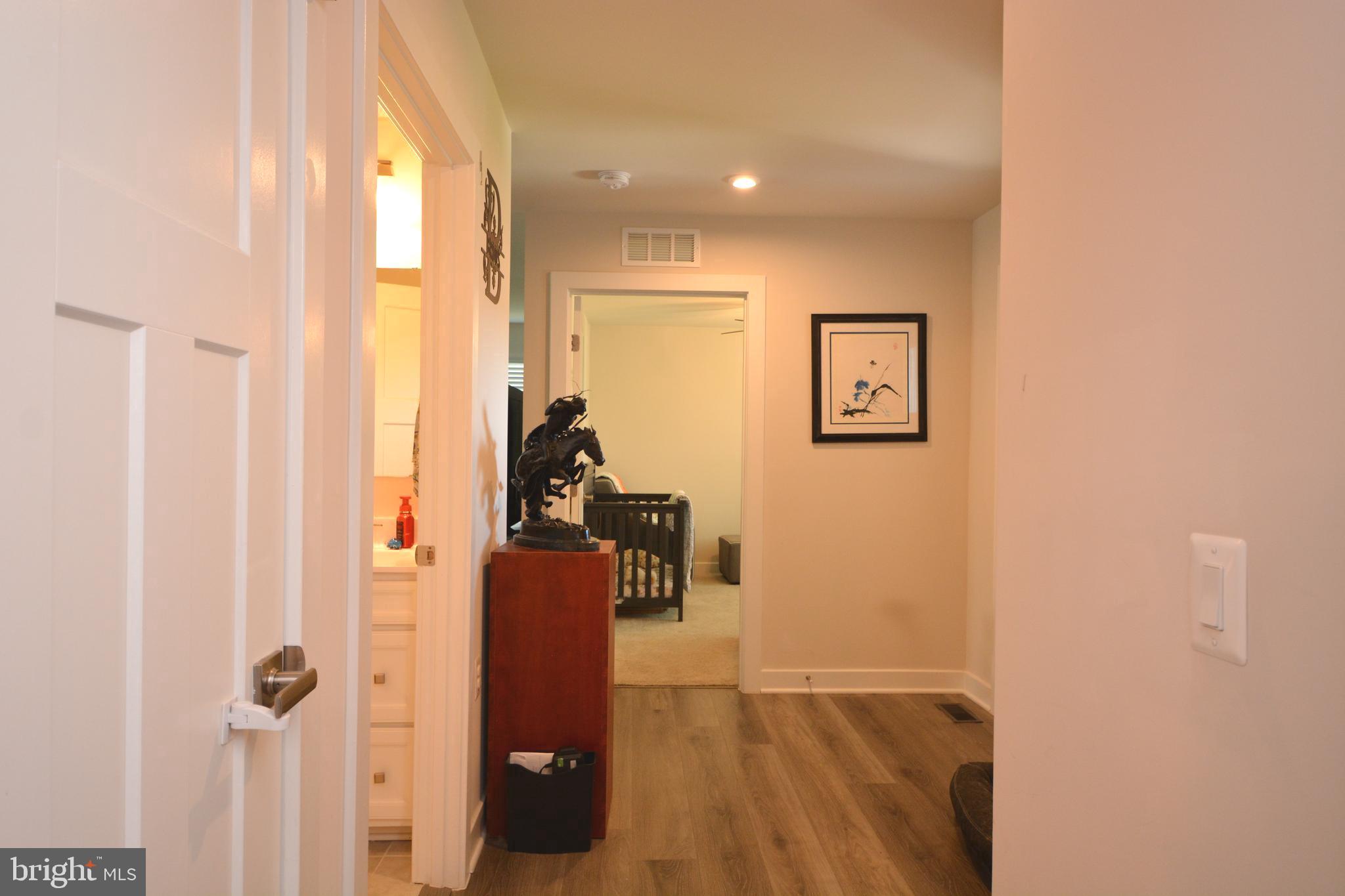 111 Tilapia Road Inwood, WV 25428 - Photo 10 of 29 a view of a hallway with paintings on the wall