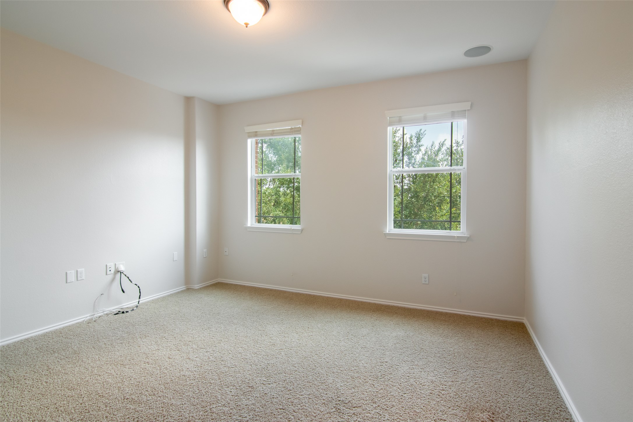 12104 Broten Street Austin, TX 78748 - Photo 23 of 32 Two windows offer verdant tree views from this adaptable room with plush carpeting.