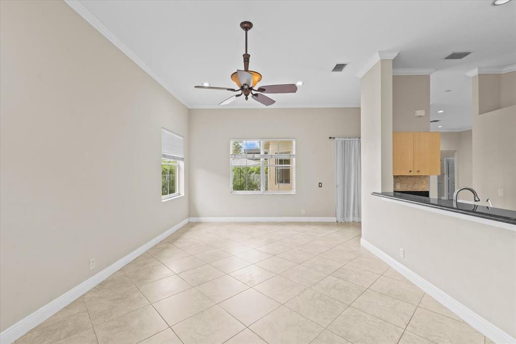 1441 Cardinal Way Weston, FL 33327 - Photo 22 of 96 a view of a kitchen with a sink and a chandelier fan