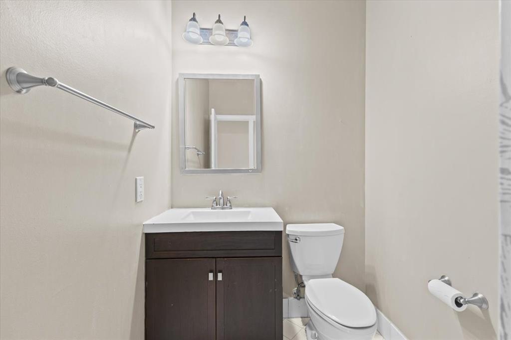 1441 Cardinal Way Weston, FL 33327 - Photo 25 of 96 a bathroom with a toilet a sink and mirror