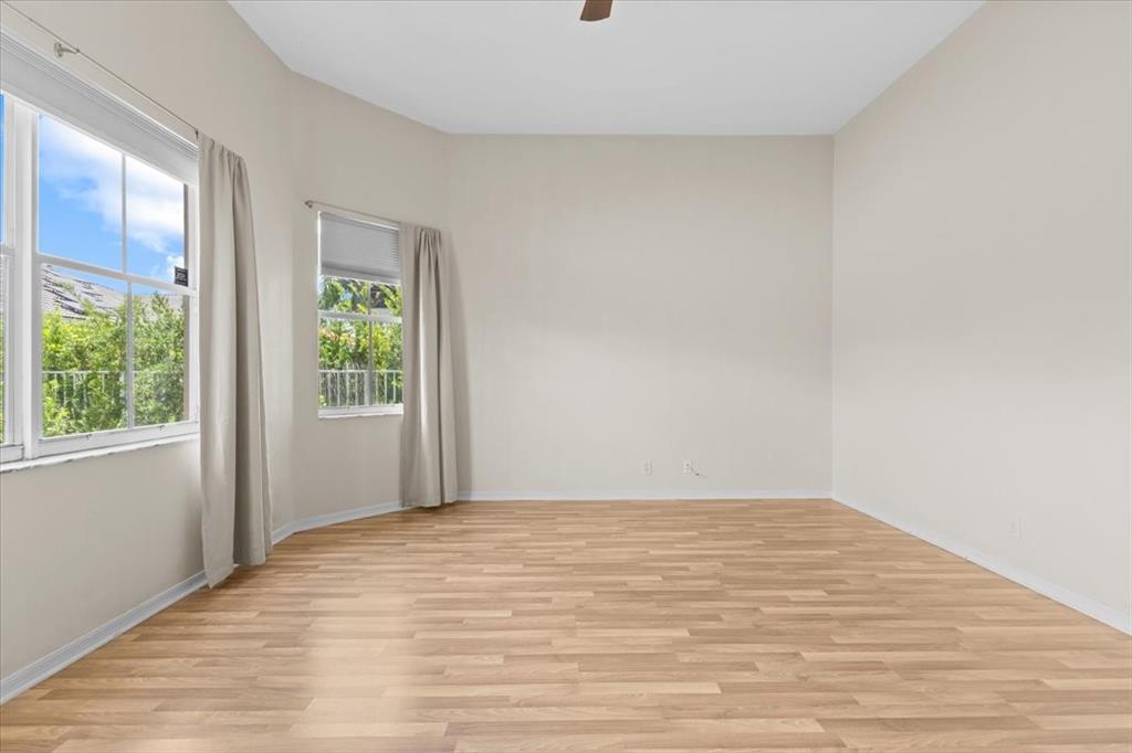 1441 Cardinal Way Weston, FL 33327 - Photo 43 of 96 a view of empty room with wooden floor and fan