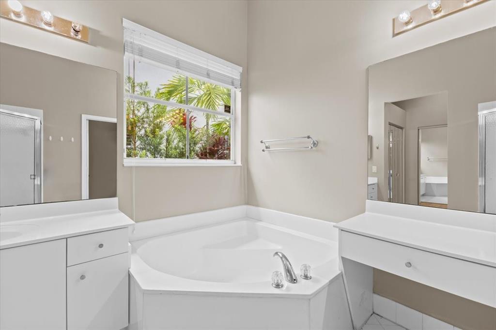 1441 Cardinal Way Weston, FL 33327 - Photo 52 of 96 a bathroom with a bathtub and a sink