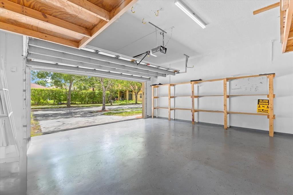 1441 Cardinal Way Weston, FL 33327 - Photo 57 of 96 a view of a livingroom with an empty space and a window