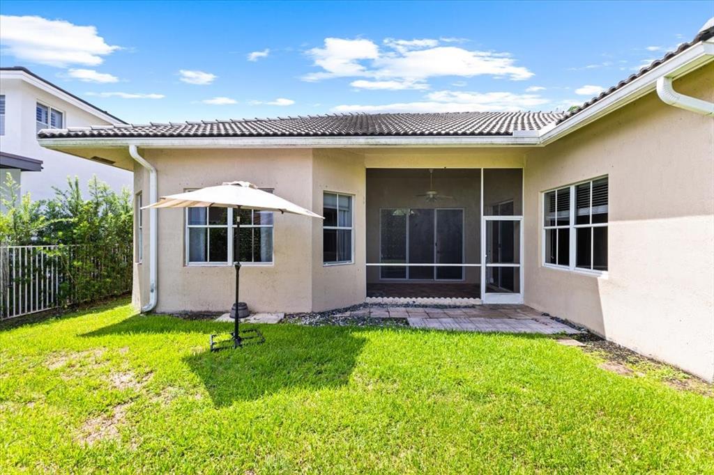 1441 Cardinal Way Weston, FL 33327 - Photo 63 of 96 a view of a house with a yard and sitting area