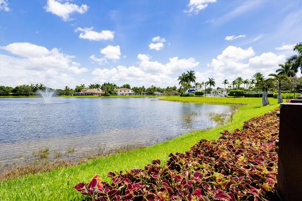 1441 Cardinal Way Weston, FL 33327 - Photo 67 of 96 a view of a lake with a big yard