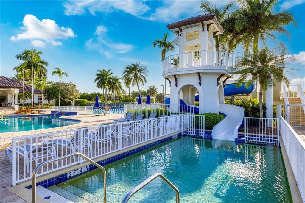 1441 Cardinal Way Weston, FL 33327 - Photo 70 of 96 a view of swimming pool with outdoor seating and plants