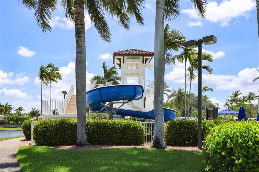 1441 Cardinal Way Weston, FL 33327 - Photo 71 of 96 a view of a palm trees in front of a house