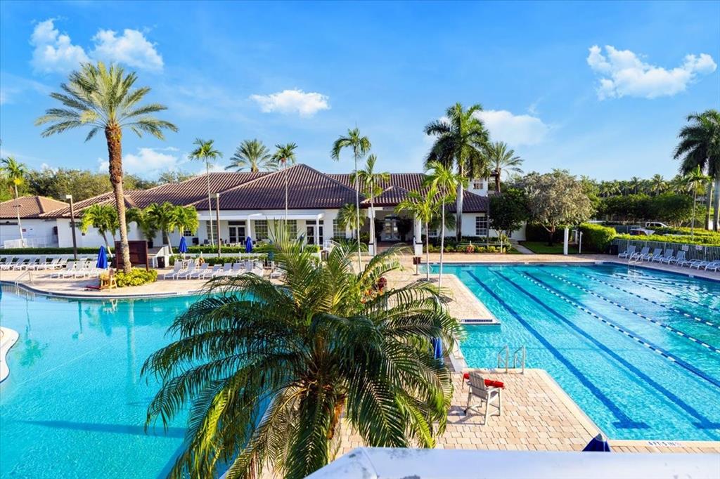 1441 Cardinal Way Weston, FL 33327 - Photo 87 of 96 a swimming pool with outdoor seating and yard