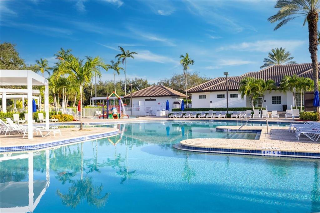 1441 Cardinal Way Weston, FL 33327 - Photo 90 of 96 a view of a swimming pool with a patio