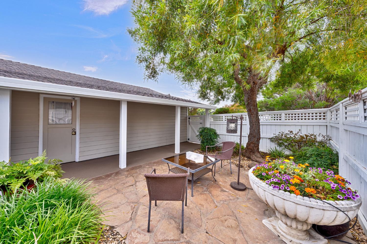 5422 Earnell Street Carmichael, CA 95608 - Photo 4 of 39 a backyard of a house with lots of green space and fountain