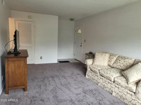 a living room with furniture and a window