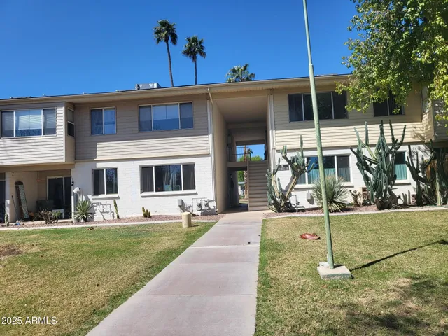 a view of a house with a yard porch and sitting area