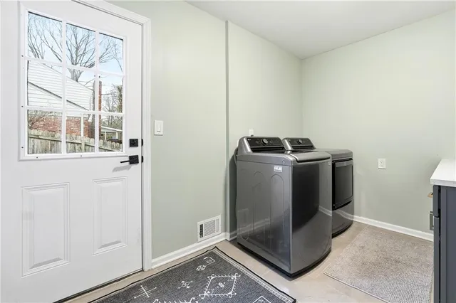 a view of a storage and utility room with a window