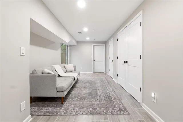 a living room with furniture and a rug