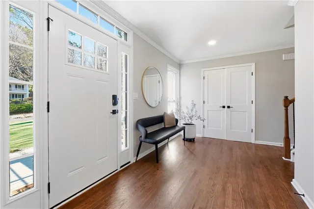 a view of a livingroom with furniture and wooden floor