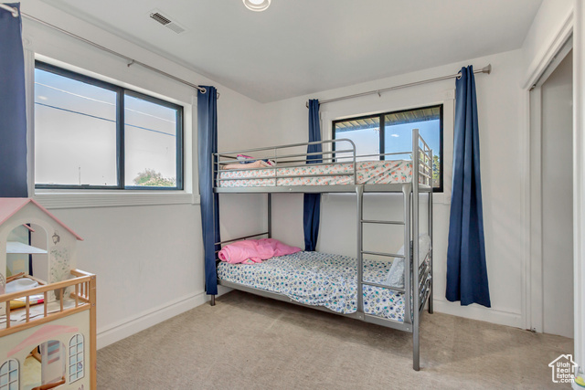 360 East Center Street Centerville, UT 84014 - Photo 29 of 41 Bedroom featuring light carpet and baseboards