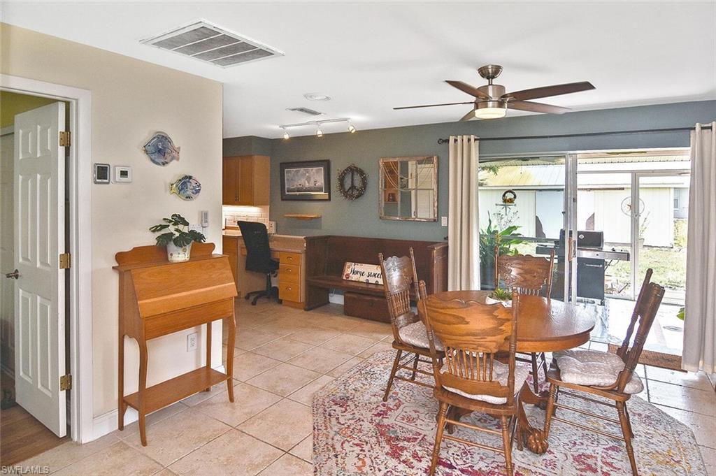 19031 Evergreen Road Fort Myers, FL 33967 - Photo 11 of 44 a dining room with furniture and window