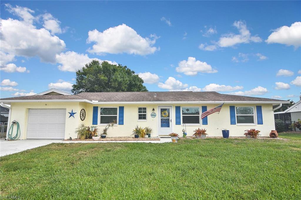 19031 Evergreen Road Fort Myers, FL 33967 - Photo 2 of 44 a view of a house with backyard and porch