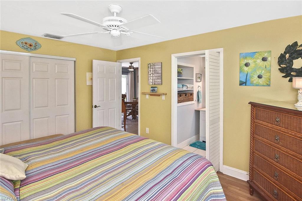 19031 Evergreen Road Fort Myers, FL 33967 - Photo 23 of 44 a bedroom with a bed and a dresser