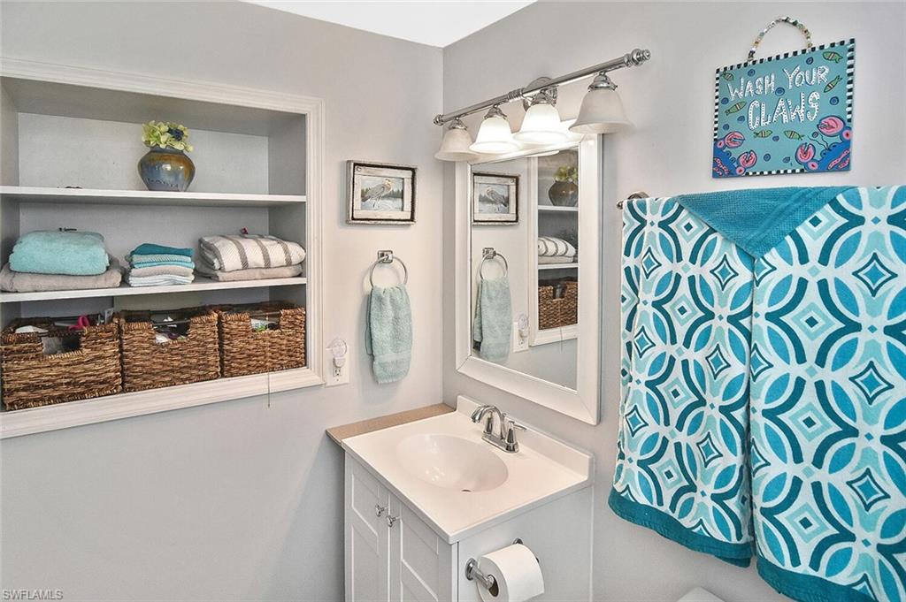 19031 Evergreen Road Fort Myers, FL 33967 - Photo 26 of 44 a bathroom with a sink and a mirror