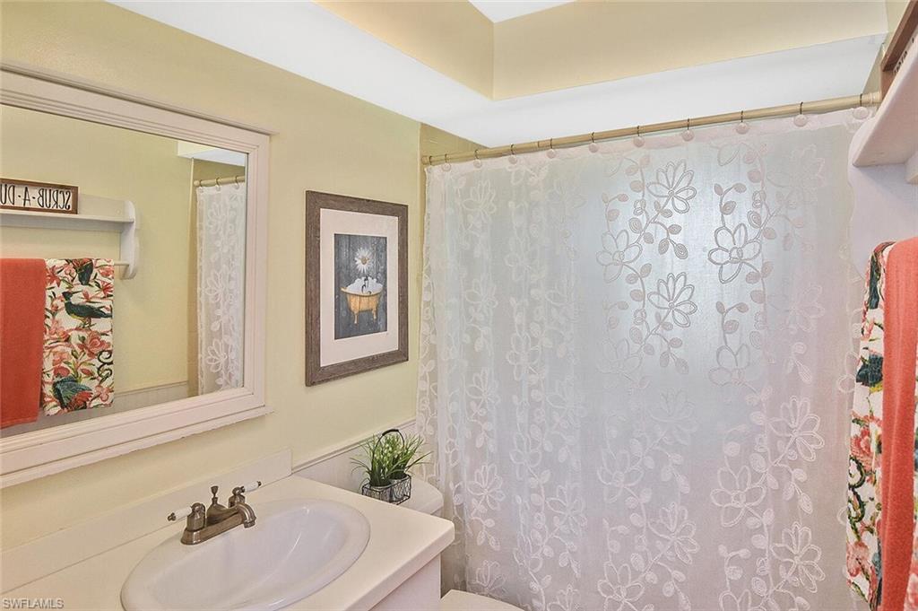 19031 Evergreen Road Fort Myers, FL 33967 - Photo 30 of 44 a bathroom with a sink and a mirror