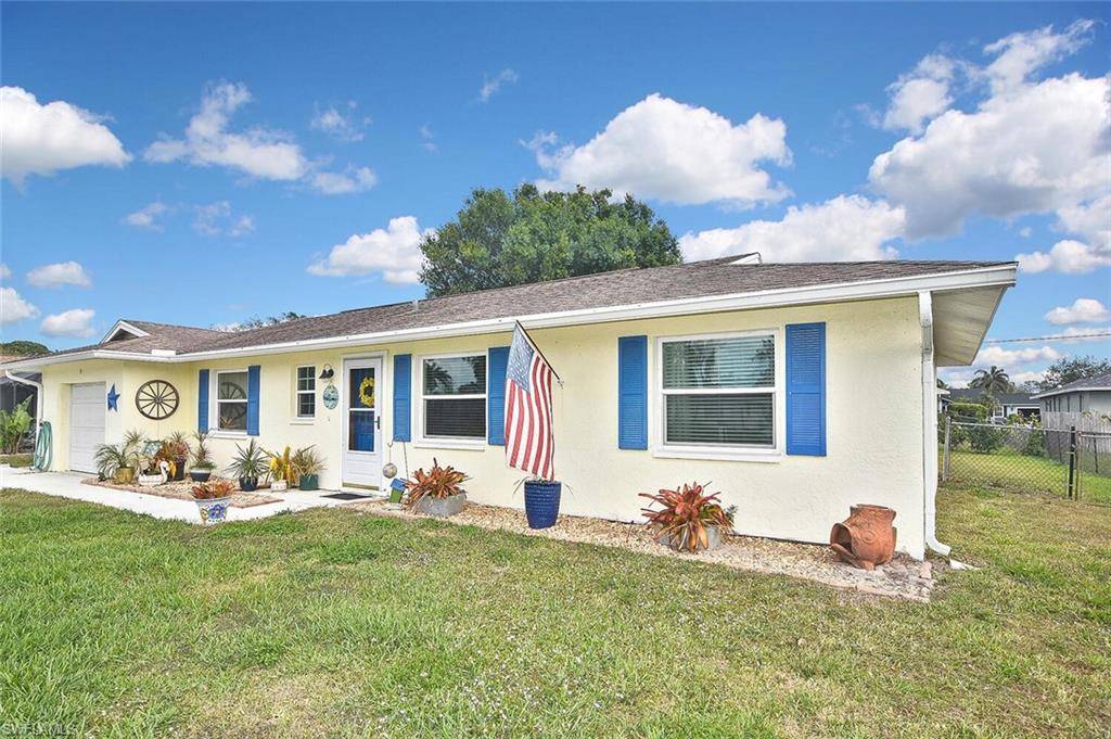 19031 Evergreen Road Fort Myers, FL 33967 - Photo 3 of 44 a front view of house with yard having seating