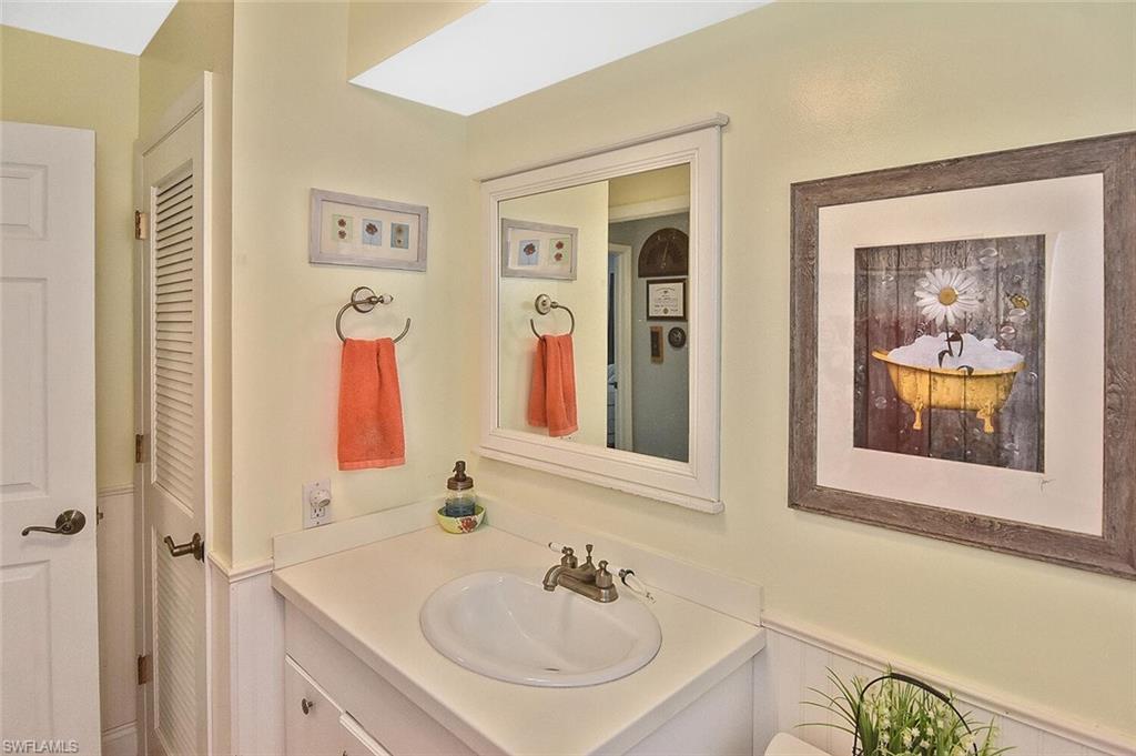 19031 Evergreen Road Fort Myers, FL 33967 - Photo 31 of 44 a bathroom with a sink and a mirror