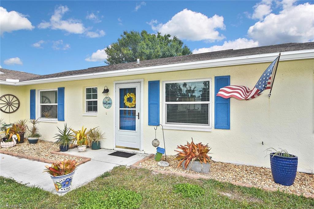 19031 Evergreen Road Fort Myers, FL 33967 - Photo 4 of 44 a front view of a house with patio