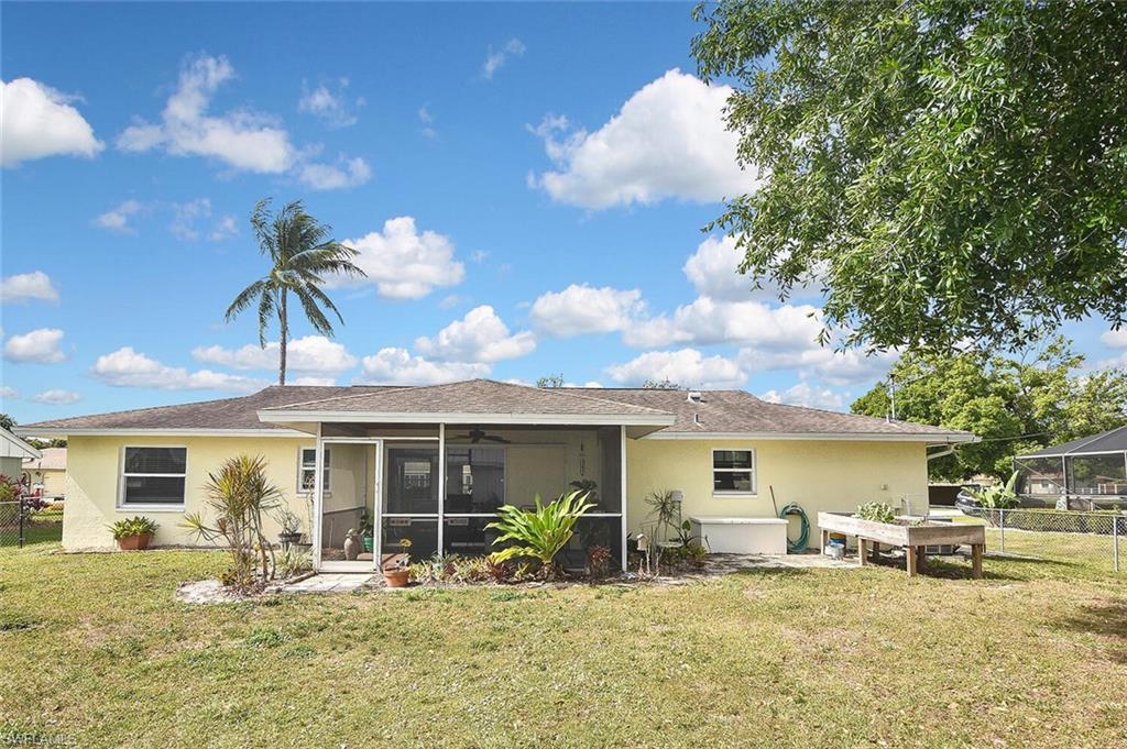 19031 Evergreen Road Fort Myers, FL 33967 - Photo 44 of 44 a backyard of a house with table and chairs