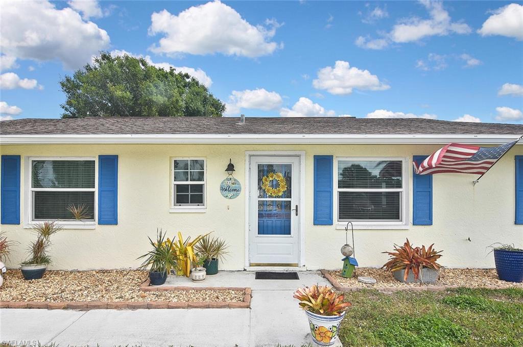 19031 Evergreen Road Fort Myers, FL 33967 - Photo 5 of 44 a front view of a house with a yard