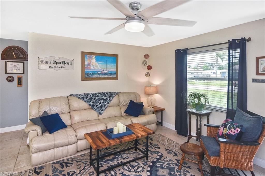 19031 Evergreen Road Fort Myers, FL 33967 - Photo 9 of 44 a living room with furniture and a large window