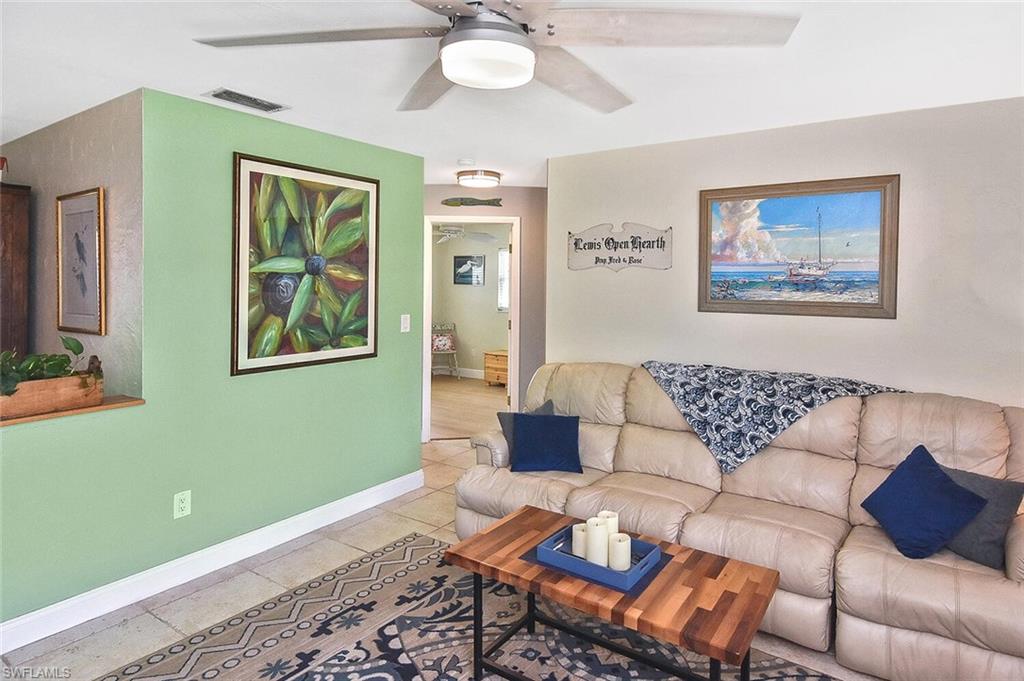 19031 Evergreen Road Fort Myers, FL 33967 - Photo 10 of 44 a living room with furniture and a window