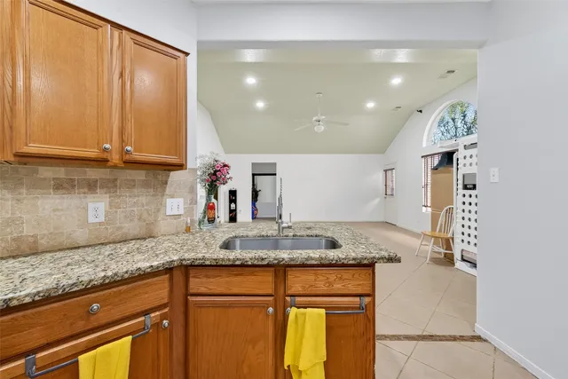 a kitchen with granite countertop cabinets and a counter top space
