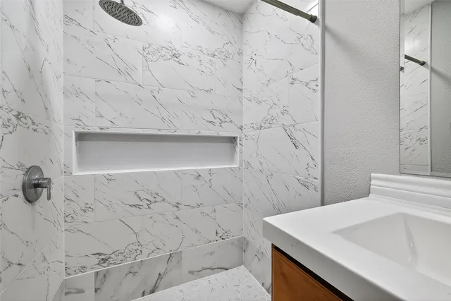 a bathroom with a sink and vanity
