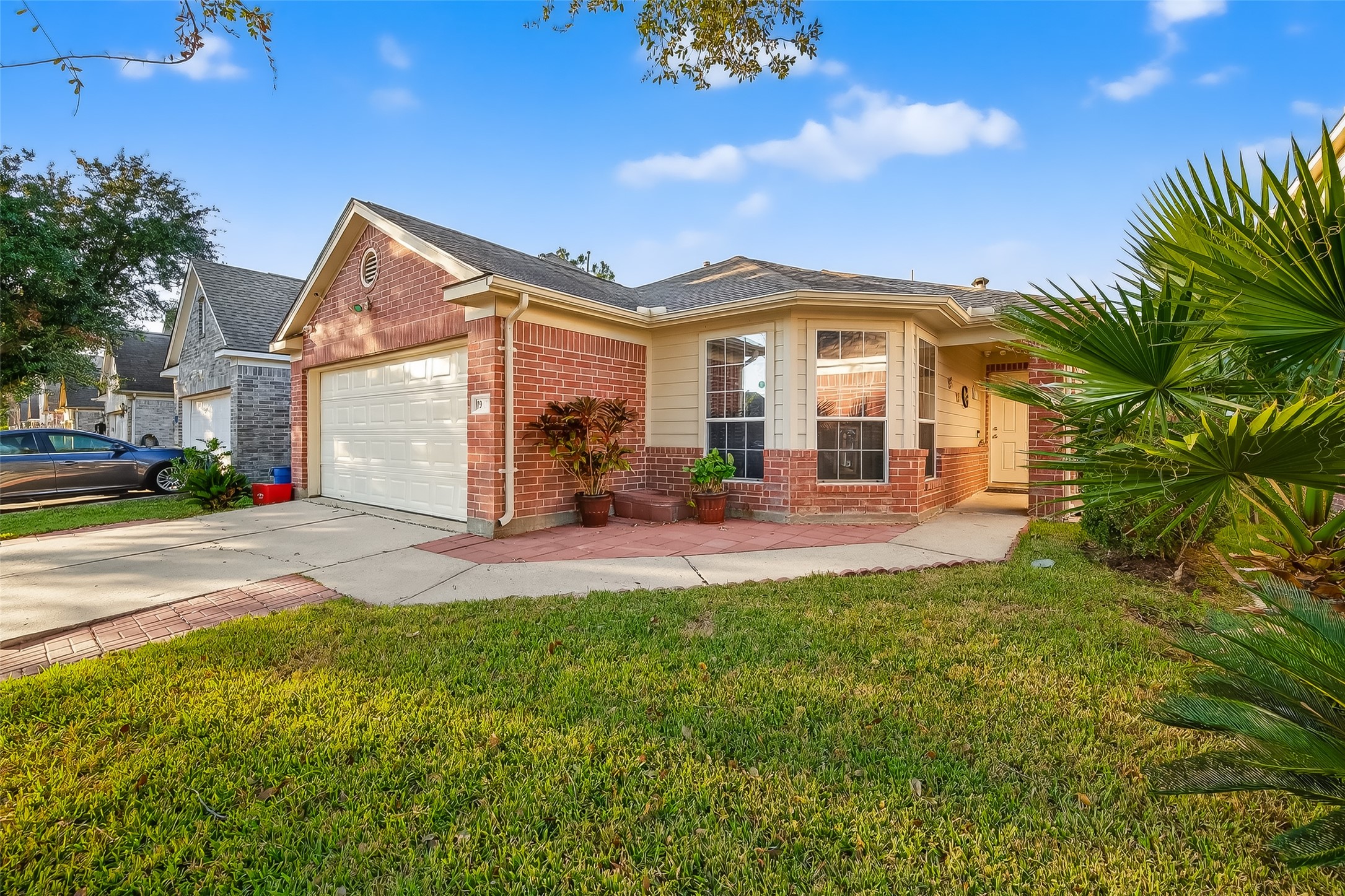 19322 Dawn Canyon Road Houston, TX 77084 - Photo 2 of 33 a front view of a house with a yard and garage