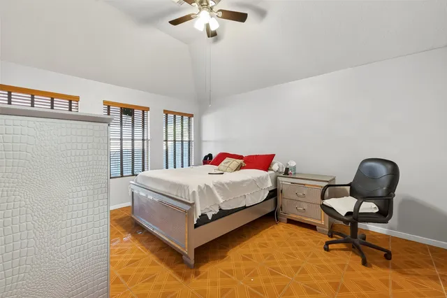 a bedroom with a bed and a chair