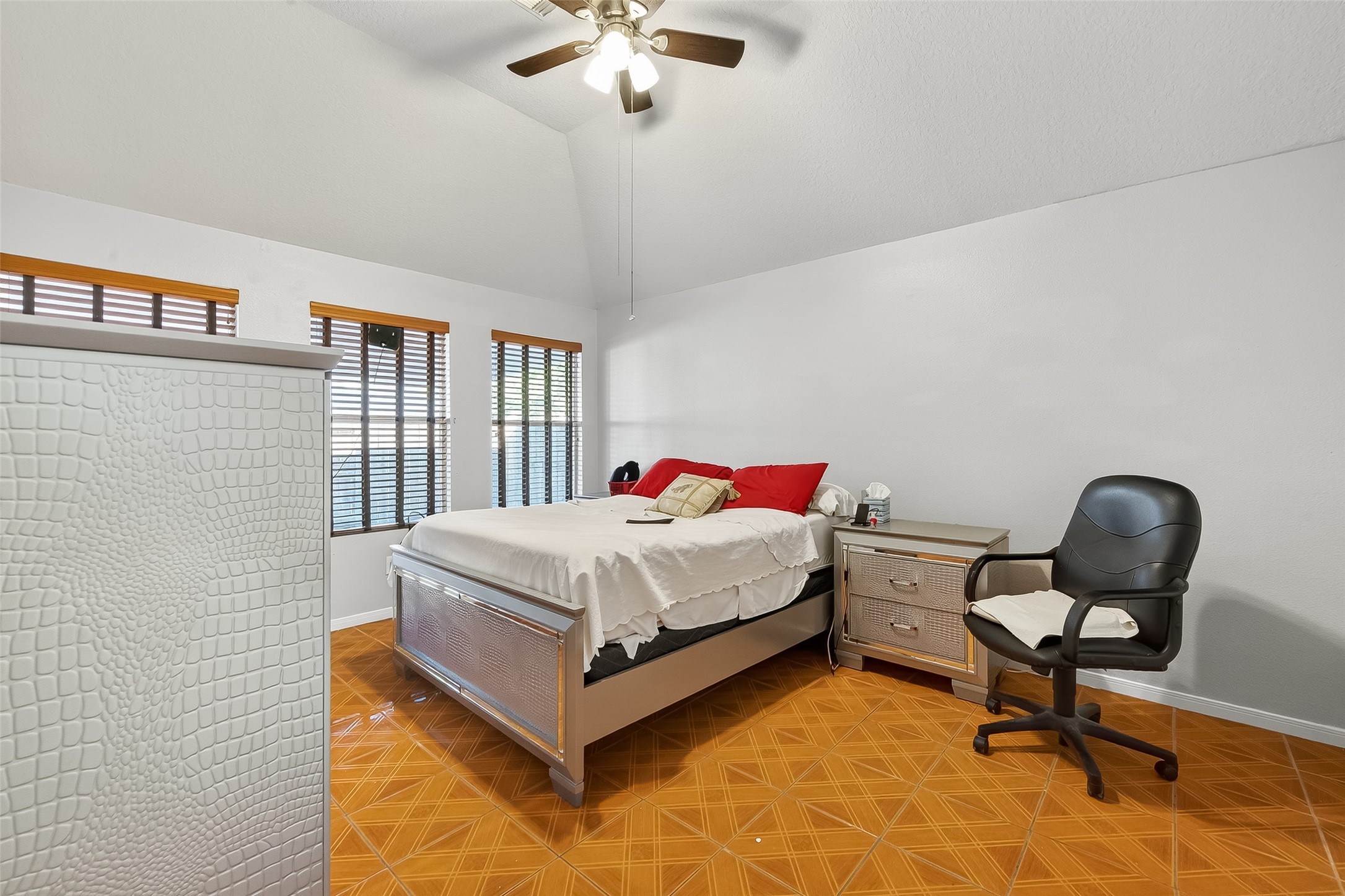 19322 Dawn Canyon Road Houston, TX 77084 - Photo 23 of 33 a bedroom with a bed and a chair